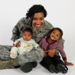 Senior Airman Jenay Randolph, 6th Air Mobility Wing Public Affairs photojournalist, poses for a picture with her children Nov. 25, 2013 at MacDill Air Force Base, Fla. Randolph is the mother of two under the age of two that finds the balance between single motherhood and active-duty Air Force.The son, Jaylen Brown, is 17 months and the daughter, Jordyn, is four months.(U.S. Air Force photo by Senior Airman Shandresha Mitchell/Released)