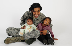 Senior Airman Jenay Randolph, 6th Air Mobility Wing Public Affairs photojournalist, poses for a picture with her children Nov. 25, 2013 at MacDill Air Force Base, Fla. Randolph is the mother of two under the age of two that finds the balance between single motherhood and active-duty Air Force.The son, Jaylen Brown, is 17 months and the daughter, Jordyn, is four months.(U.S. Air Force photo by Senior Airman Shandresha Mitchell/Released)